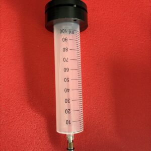 Depósito 100ml purgado y llenado. Jeringa 100ml.
